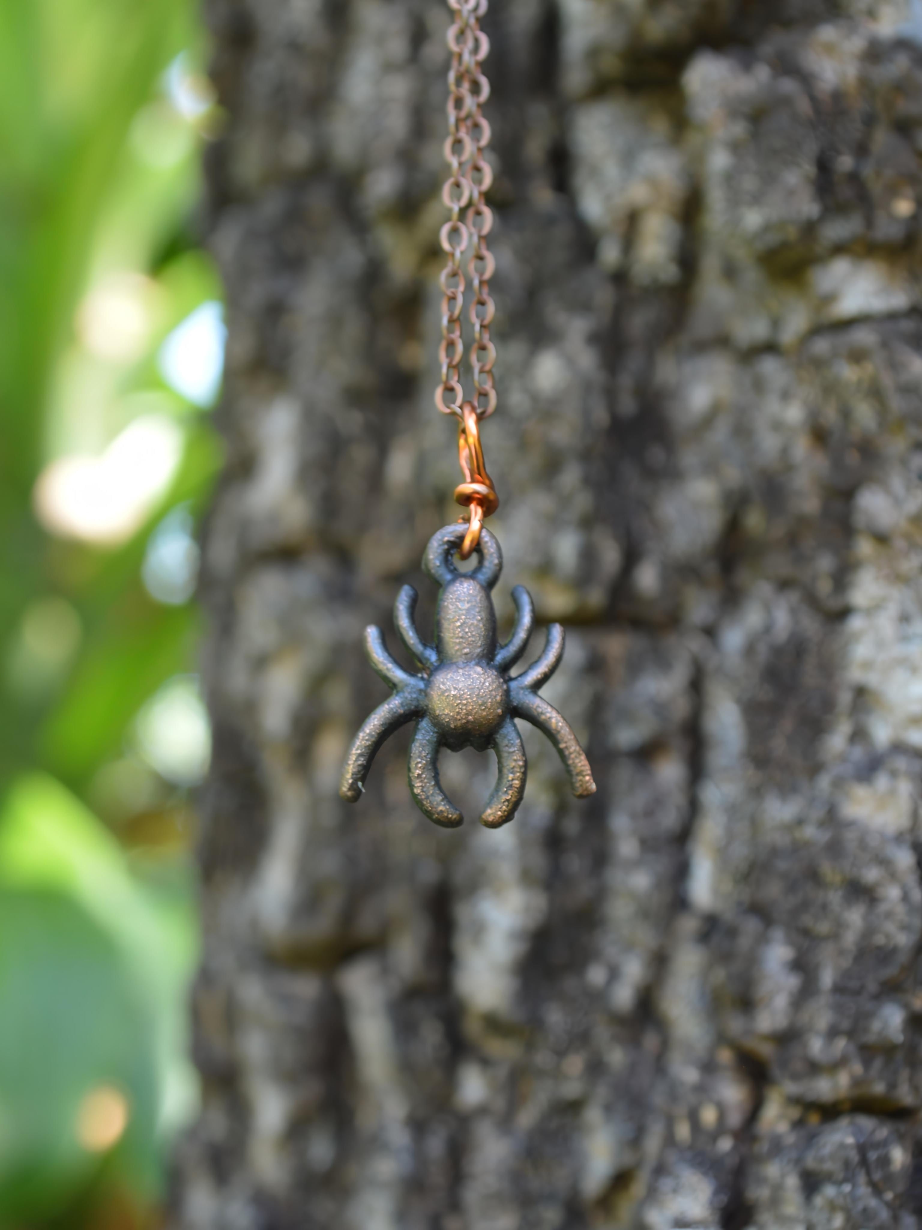 Copper-coated faux spider pendant